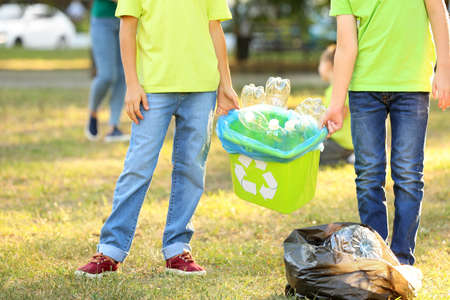 People gathering garbage outdoors. Concept of recyclingの写真素材