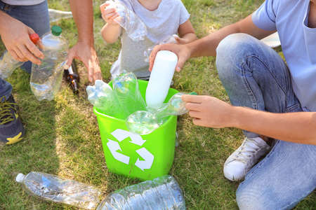 People gathering garbage outdoors. Concept of recyclingの写真素材