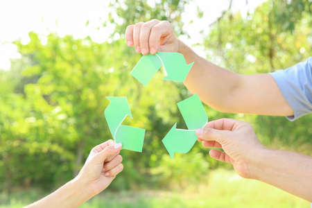 People holding sign of recycling outdoorsの写真素材