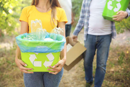 Volunteers with garbage outdoors. Concept of recyclingの写真素材