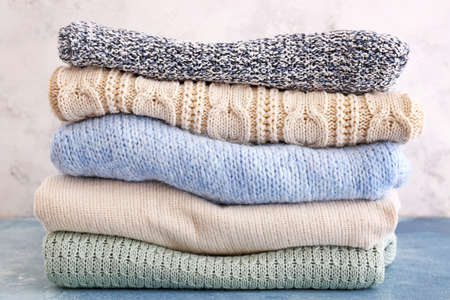 Set of warm winter clothes on tableの写真素材