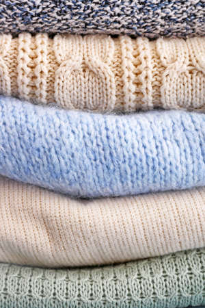 Stack of warm winter clothes, closeupの写真素材