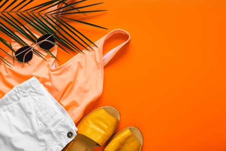 Summer composition with female clothes on color backgroundの写真素材