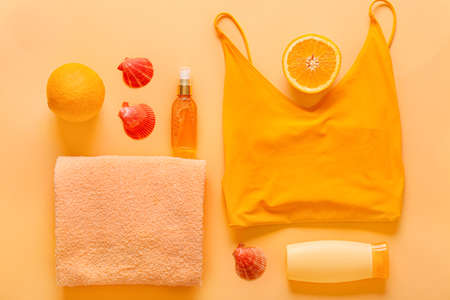 Summer composition with female swimsuit and accessories on color backgroundの写真素材