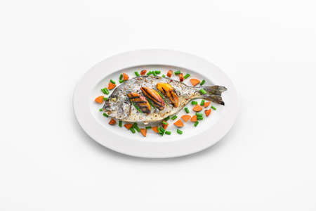 Plate with prepared dorado fish on white backgroundの写真素材