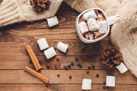 Cup of hot chocolate with marshmallows on wooden tableの写真素材