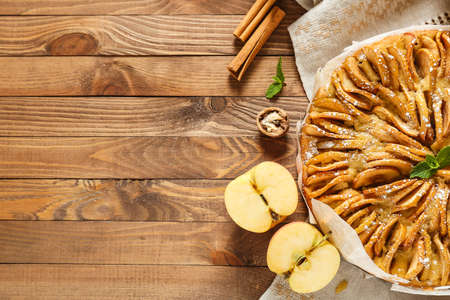 Sweet apple pie on wooden tableの写真素材