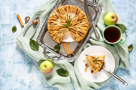 Composition with sweet apple pie on tableの写真素材
