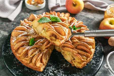 Sweet apple pie on tableの写真素材