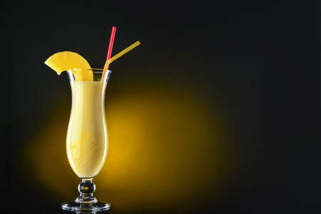 Glass of tasty summer cocktail on dark backgroundの写真素材