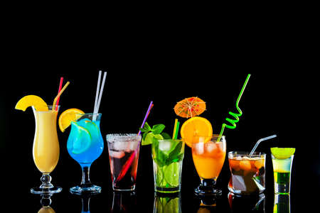 Different tasty cocktails on dark backgroundの写真素材