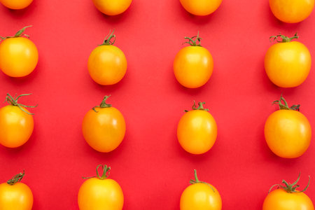 Fresh tomatoes on color backgroundの写真素材