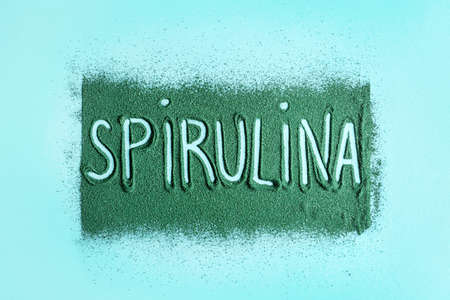 Word SPIRULINA made of powder on color backgroundの写真素材