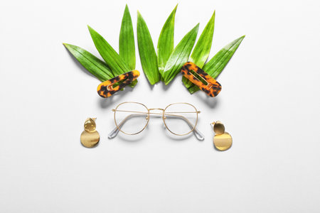 Funny composition with stylish female accessories on white backgroundの写真素材