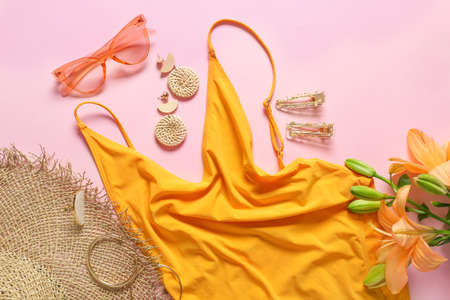 Modern female look with stylish accessories on color background