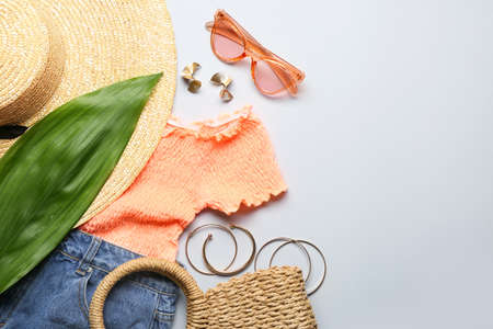 Modern female look with stylish accessories on white background