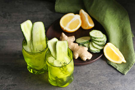Composition with healthy infused water and ingredients on tableの写真素材