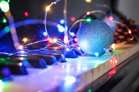 Piano keyboard with Christmas decor, closeupの写真素材