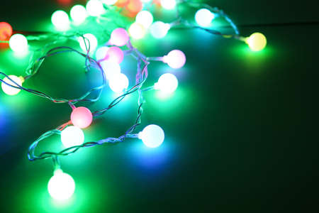Beautiful Christmas lights on dark background