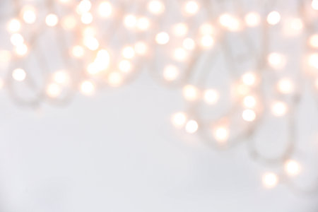 Blurred Christmas lights on white backgroundの写真素材