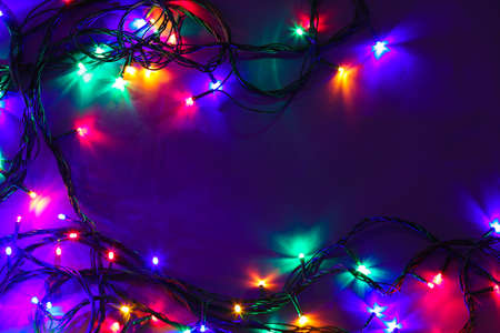 Beautiful Christmas lights on dark backgroundの写真素材