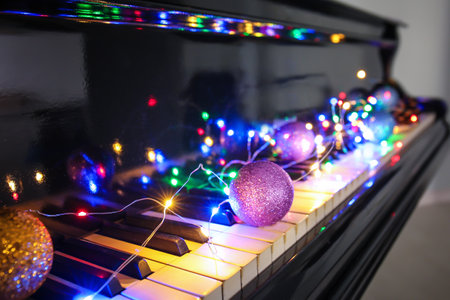 Piano keyboard with Christmas decor, closeupの写真素材
