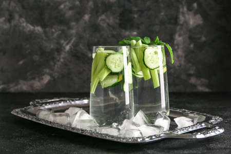 Glasses of healthy infused water on table