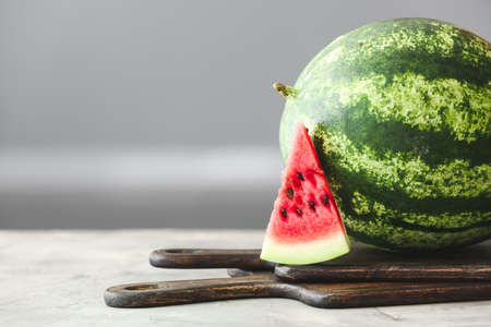 Ripe watermelon on kitchen tableの写真素材