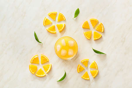 Composition with fresh orange juice on table