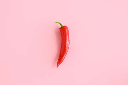 Red chili pepper on color backgroundの写真素材