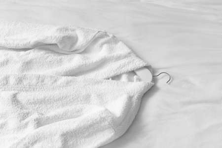 Soft clean bathrobe on bedの写真素材