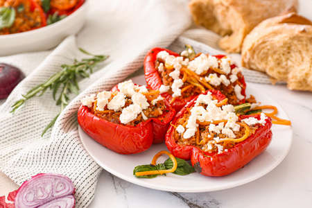 Plate with tasty stuffed pepper on tableの写真素材