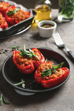 Frying pan with tasty stuffed pepper on tableの写真素材