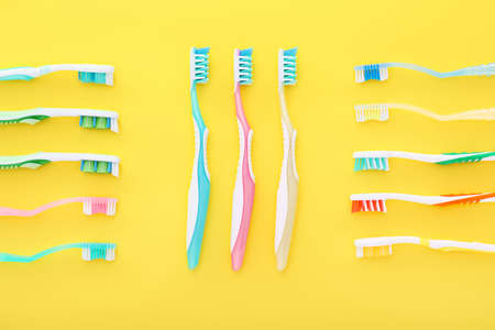 Different tooth brushes on color backgroundの写真素材