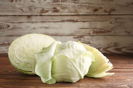 Fresh cabbage on wooden tableの写真素材