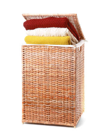 Basket with laundry on white backgroundの写真素材