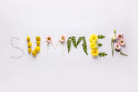 Word SUMMER made of flowers and leaves on white background