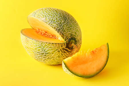 Sweet ripe melon on color backgroundの写真素材