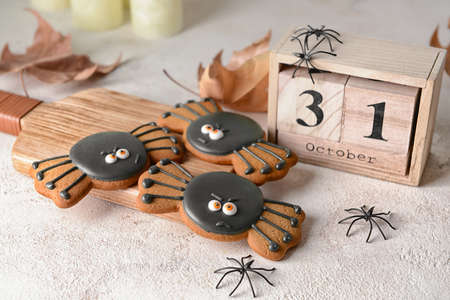 Creative Halloween cookies and calendar on tableの写真素材