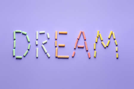 Word DREAM made of crayons on color backgroundの写真素材