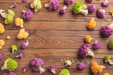 Frame made of fresh cauliflower cabbage on wooden backgroundの写真素材