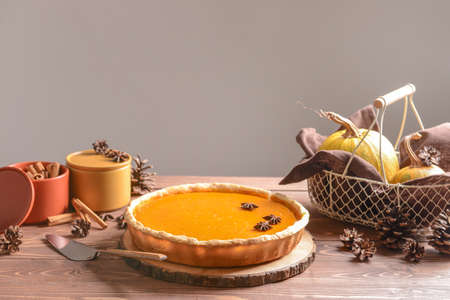Tasty pumpkin pie on wooden table