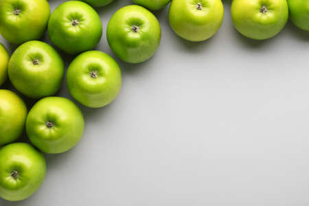 Fresh ripe apples on light backgroundの写真素材