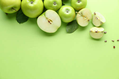 Fresh ripe apples on color backgroundの写真素材