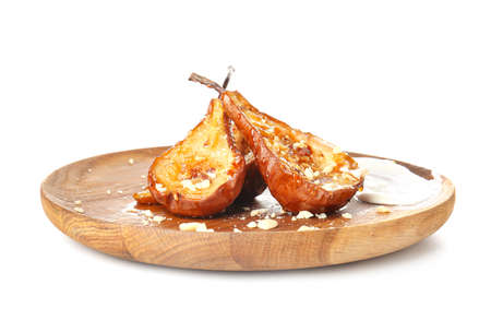 Plate with tasty cooked pears on white backgroundの写真素材