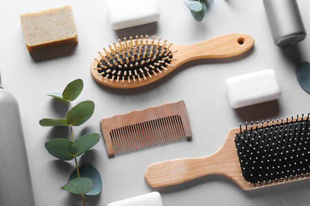 Accessories and cosmetics for personal hygiene on light background