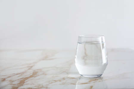 Glass of fresh water on tableの写真素材