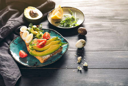 Tasty sandwiches on dark tableの写真素材