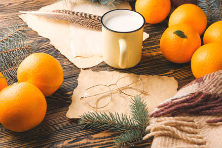 Christmas composition with fresh oranges on wooden backgroundの写真素材