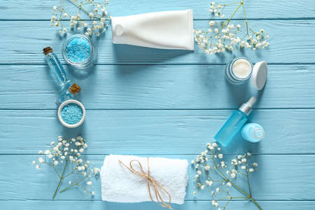 Composition with cosmetics for spa procedures on wooden background